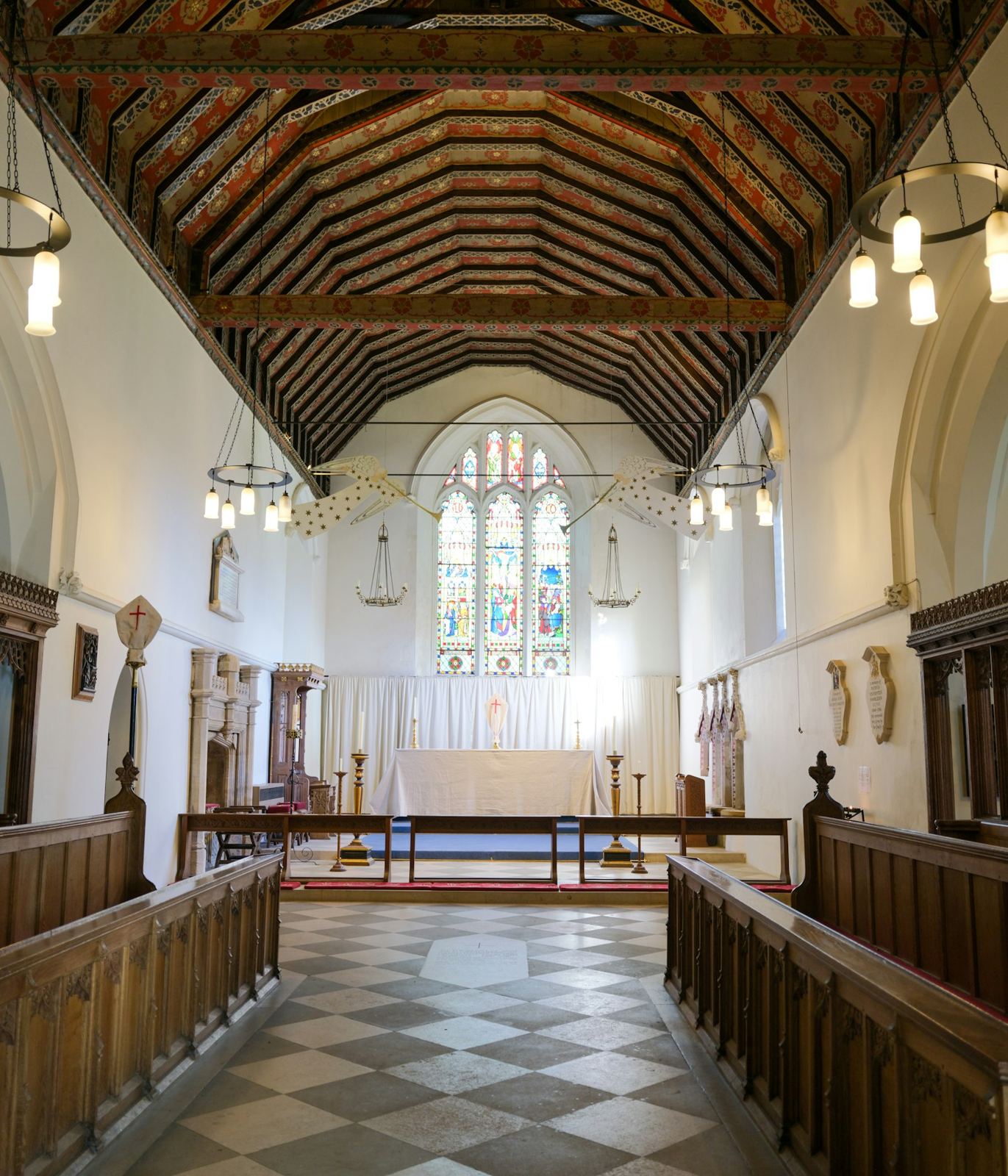 Bright church sanctuary with wooden pews