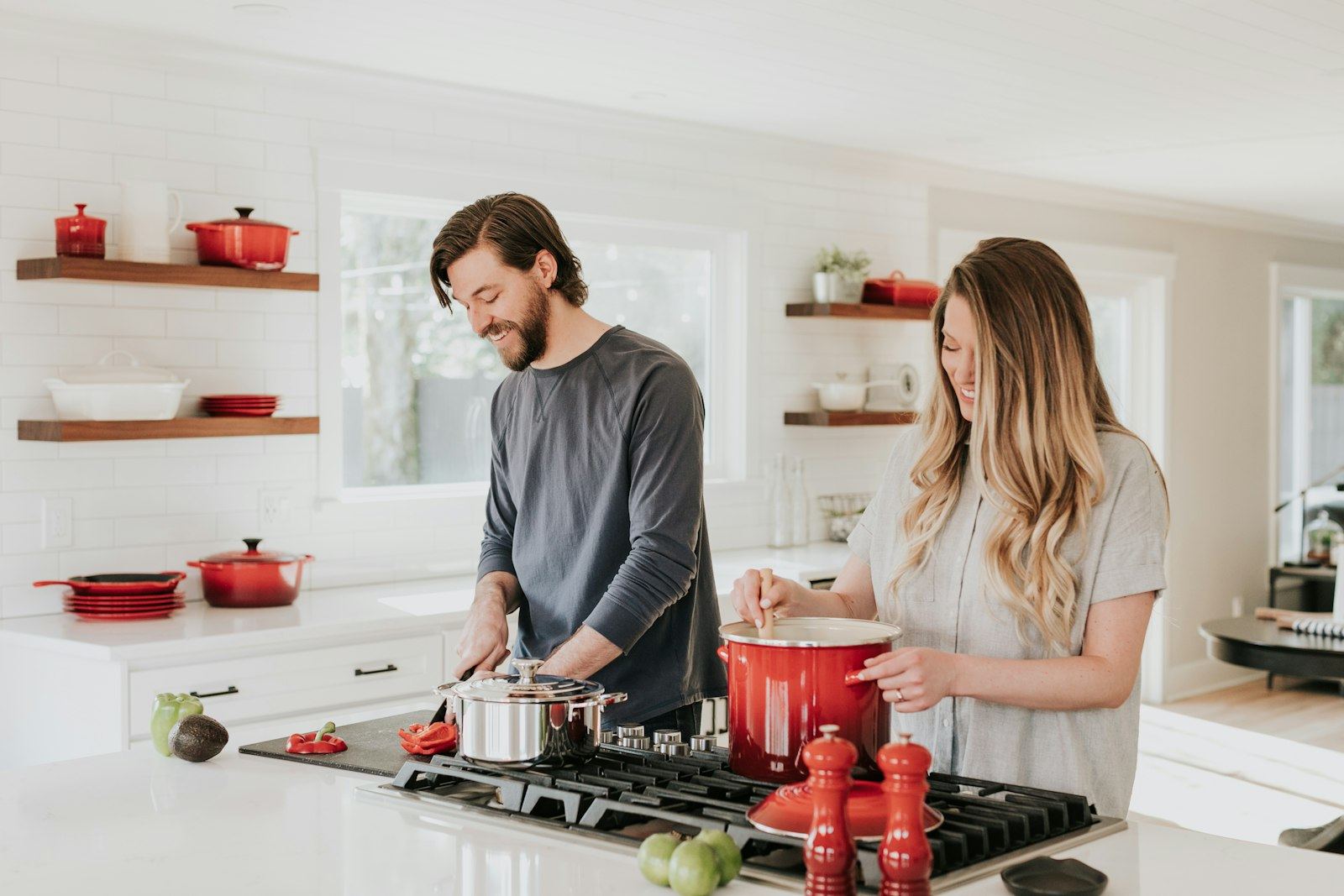 Couple cooking together in a bright home kitchen