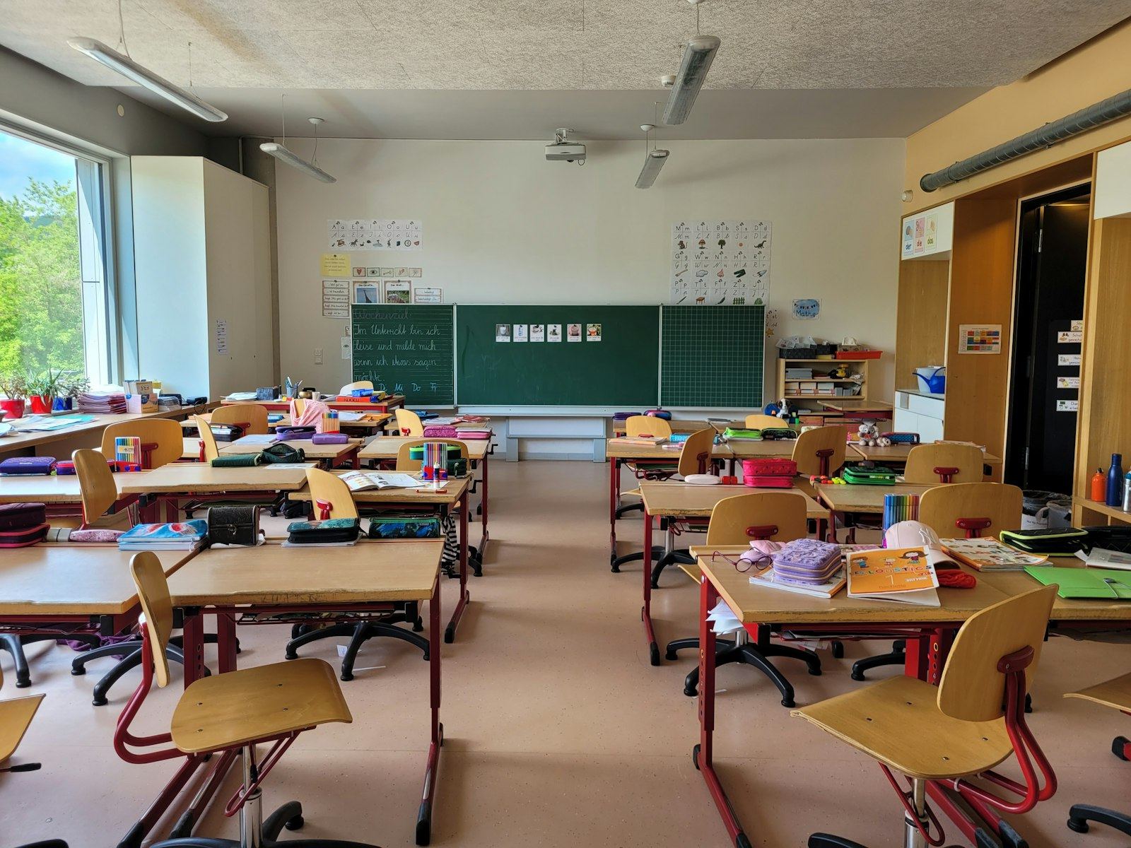 Sunlit classroom with desks and chairs